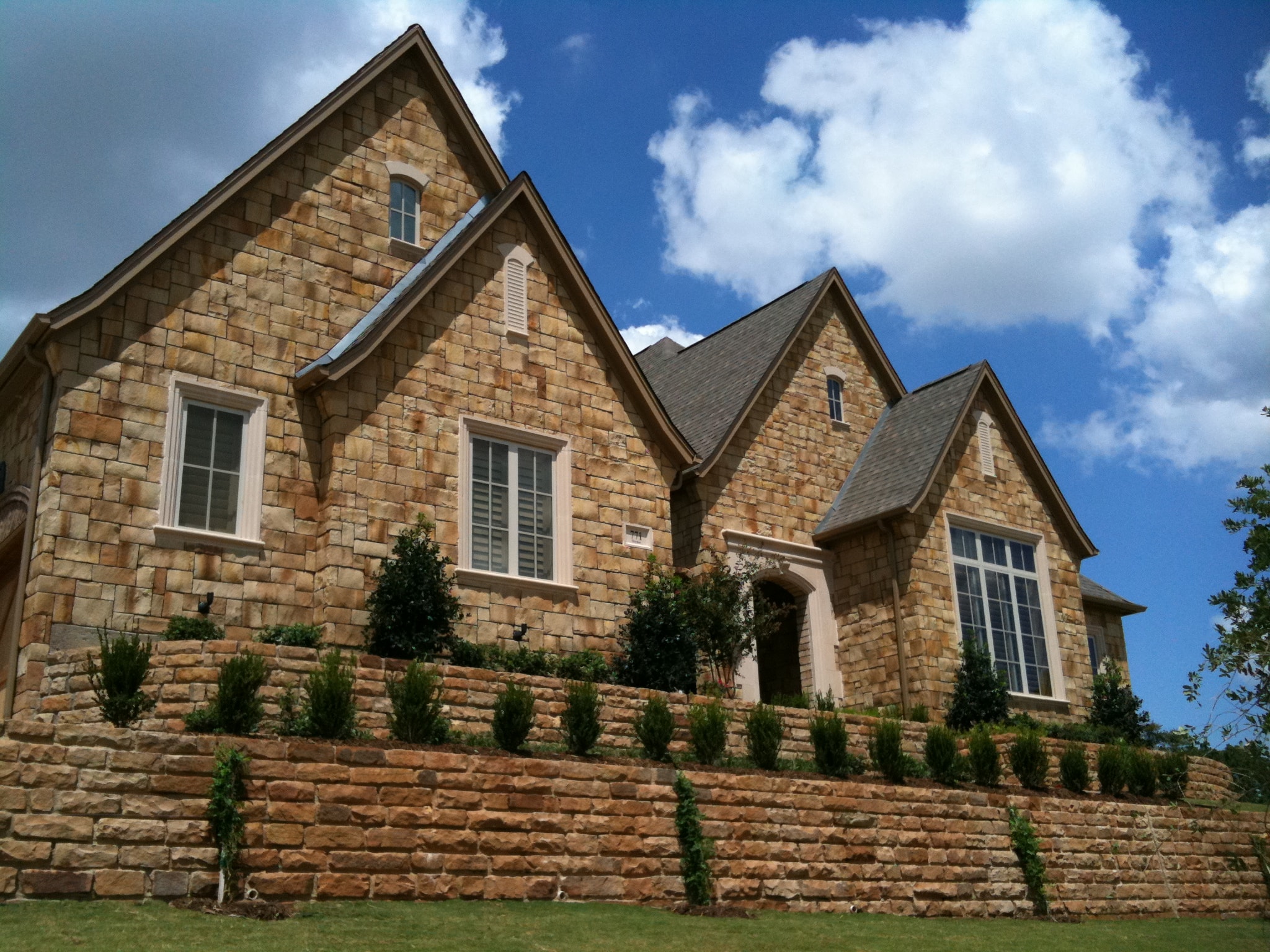 Texas style custom home with brick and stone accents built by DFW ADU Pro in the Dallas Fort Worth Metroplex