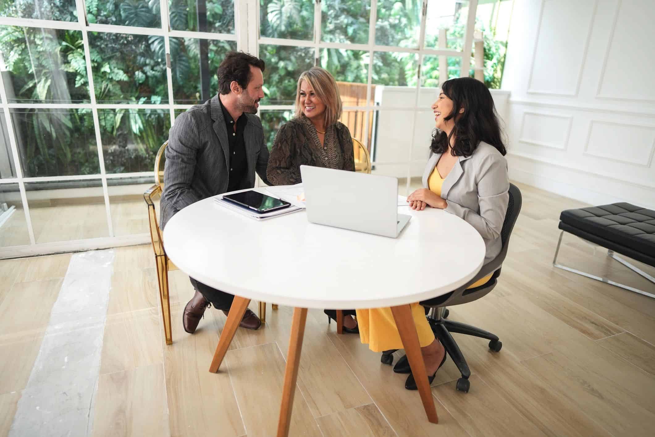 Happy homeowners speaking with a builder