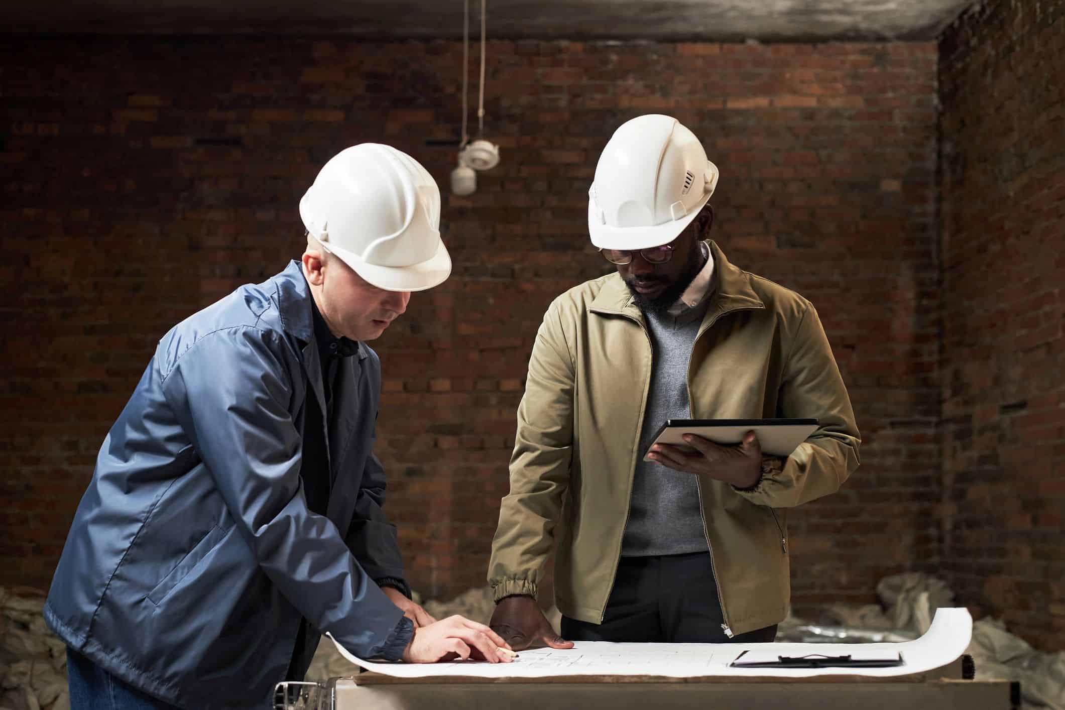 Builders reviewing plans together